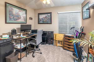 Office featuring ceiling fan, light colored carpet, and a textured ceiling