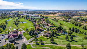 Drone / aerial view featuring a water view and Golf Course