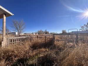 View of yard with a rural view