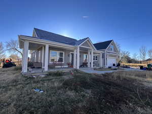 View of front of house featuring covered porch