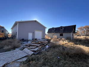 Back of property featuring a garage