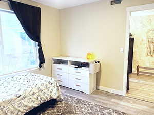 Bedroom featuring wood-type flooring