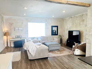 Living room with hardwood / wood-style flooring