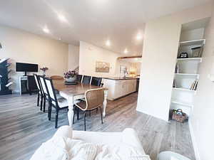 Dining room featuring sink and light wood-type flooring