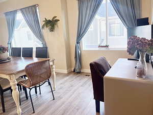 Office area with light hardwood / wood-style flooring