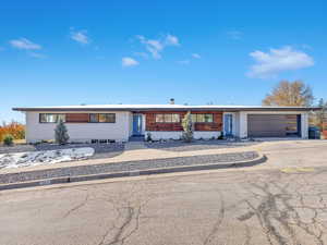 Ranch-style home featuring a garage