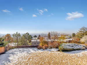 View of yard covered in snow