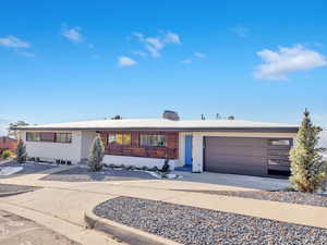 Single story home featuring a garage