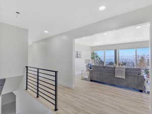 Living room featuring a mountain view and light hardwood / wood-style flooring