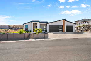 Contemporary home featuring a garage