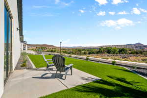 Exterior space with a mountain view and a patio