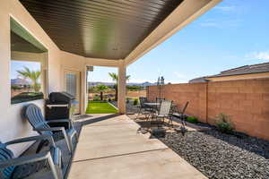 View of patio with a grill and a mountain view