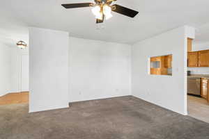 Spare room featuring ceiling fan and light hardwood / wood-style floors