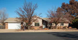 Ranch-style house featuring a garage