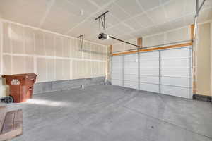 Garage featuring a garage door opener