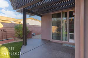 View of patio with a pergola off of primary bedroom