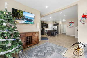 Living room featuring light hardwood / wood-style flooring and sink