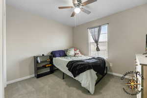 Bedroom 2 Carpeted bedroom featuring ceiling fan