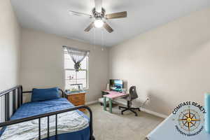 Bedroom 3 with carpet and ceiling fan and WIC