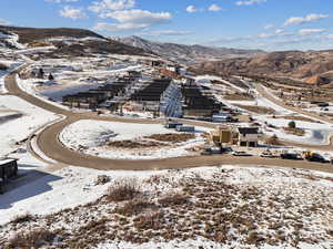 Snowy aerial view featuring a mountain view