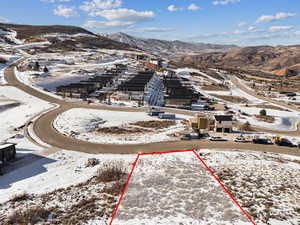 Snowy aerial view featuring a mountain view