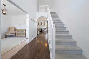 Stairway with hardwood / wood-style flooring