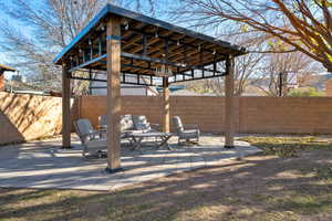 View of patio featuring a gazebo and an outdoor hangout area