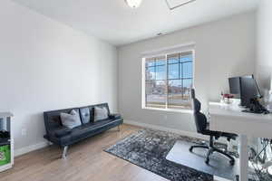 Office featuring hardwood / wood-style flooring