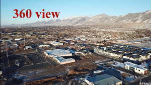 Birds eye view of property with a mountain view looking true north