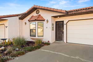 View of front facade featuring a garage