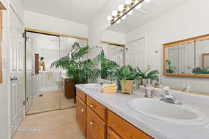 Bathroom with vanity and a textured ceiling