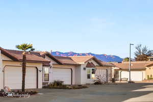 Ranch-style house with a mountain view and a garage