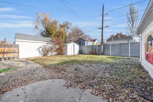 View of yard with a storage unit