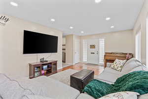 Living room with light wood-type flooring