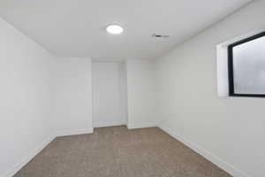 Unfurnished room featuring carpet floors