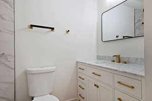 Bathroom with vanity and toilet