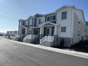 View of front of home featuring central AC