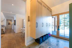 Mudroom featuring french doors and light hardwood / wood-style floors