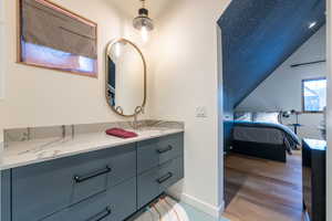 Bathroom with vanity and hardwood / wood-style flooring