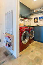 Clothes washing area with cabinets and independent washer and dryer