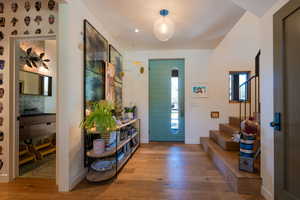 Foyer entrance with hardwood / wood-style flooring