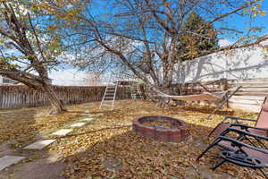 View of yard with an outdoor fire pit