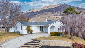 Ranch-style home featuring a mountain view