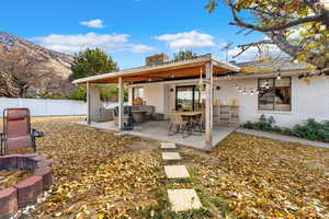 View of yard featuring a mountain view, a patio, and an outdoor hangout area