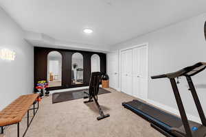 Exercise area featuring carpet floors