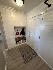 Mudroom with dark hardwood / wood-style flooring