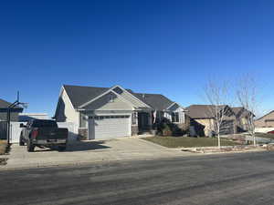 View of front facade featuring a garage