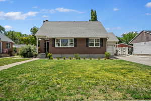 View of front facade with a garage and a front yard