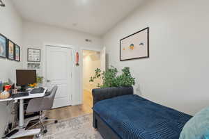 Bedroom with wood-type flooring