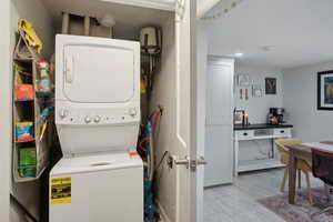 Washroom with stacked washer / drying machine